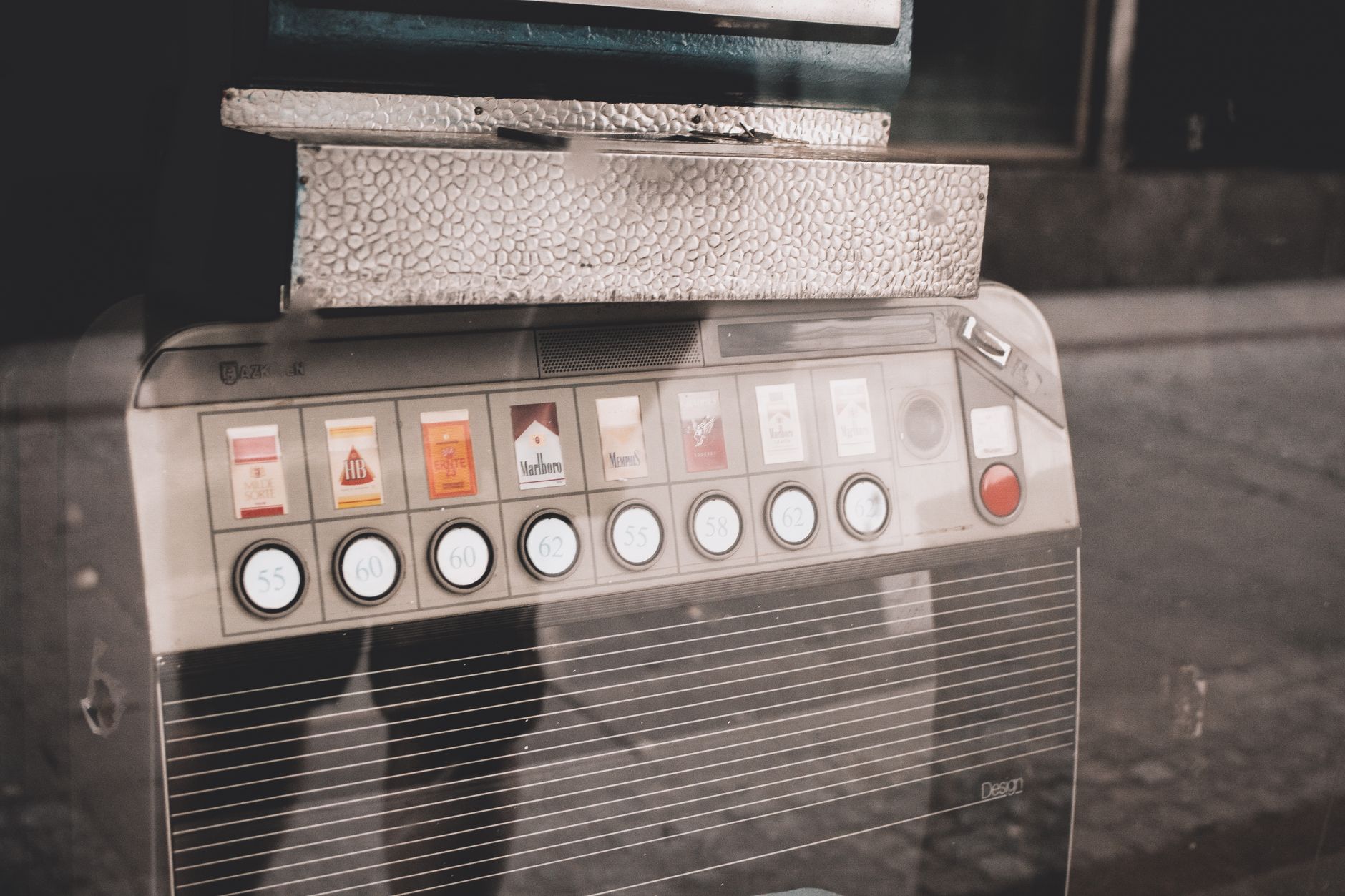 Retro cigarette vending machine on a street, reflecting urban nostalgia and vintage style.