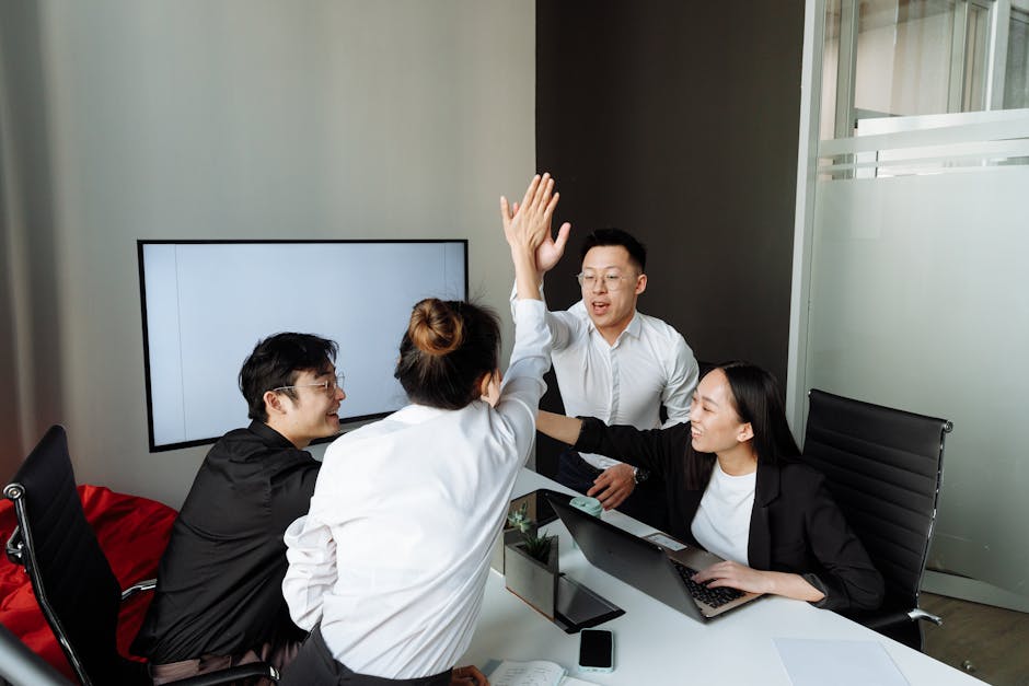 Teams celebrating successful regulatory approval represent the achievement awaiting compliant iGaming operators